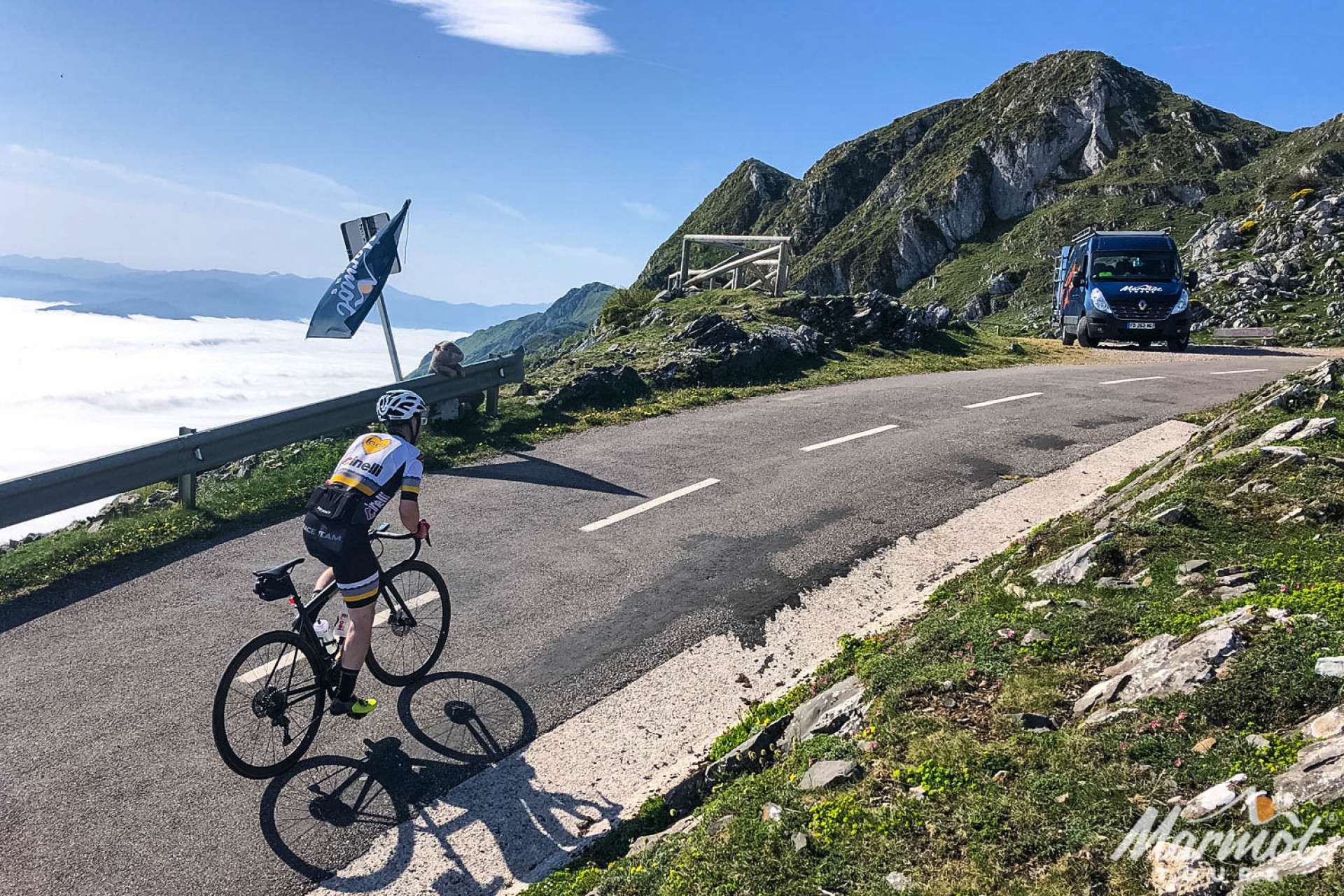Cyclist nearing summit of Alto de l'Angliru on Marmot Tours guided road cycling holiday Picos de Europa Spain