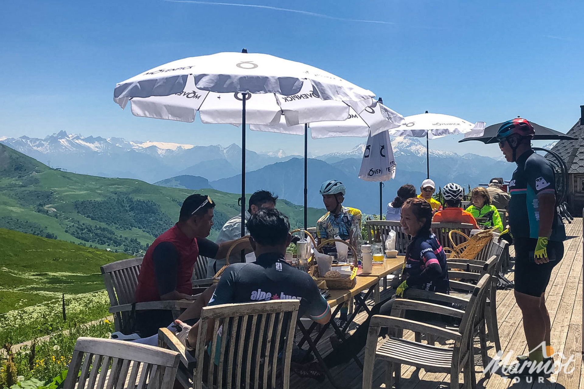 Cyclists at cafe on Col de la Madeleine with Marmot Tours road cycling holiday Alps