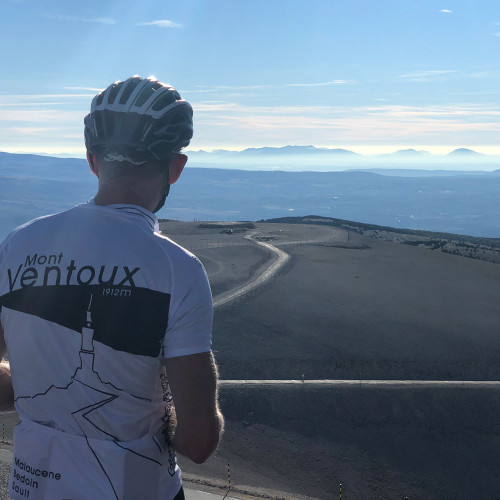 Cyclist on Marmot Tours holiday viewing landscape from summit of Mont Ventoux