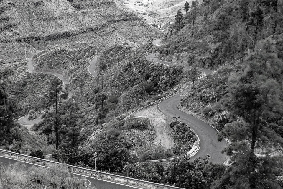 Black and white image of sweeping bends in mountain road on full support cycling holiday Gran Canaria with Marmot Tours