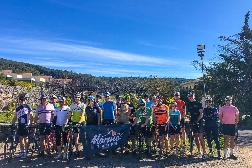 Group of cyclists pose for a photo with blue sky on Marmot Tours Tenerife cycling holiday